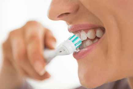 Dental hygienist performing a scale and clean